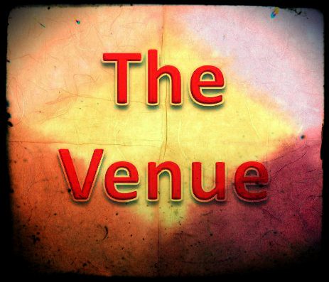 Venue logo displayed prominently on a vibrant red and yellow background.